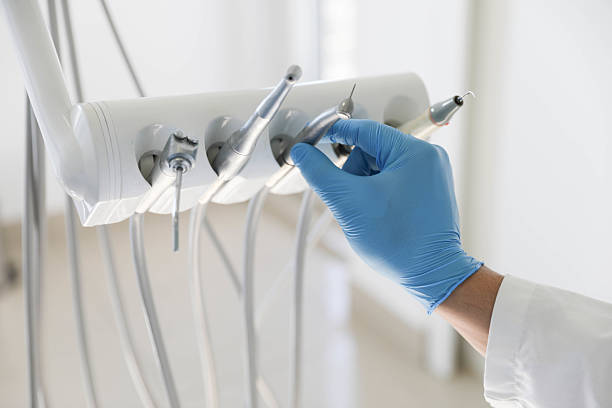 Professional Tooth Extraction technician working in Louisville, IL